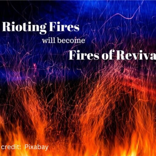 flames reaching to a blue sky