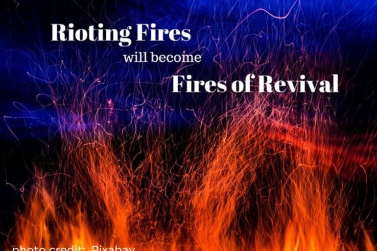flames reaching to a blue sky