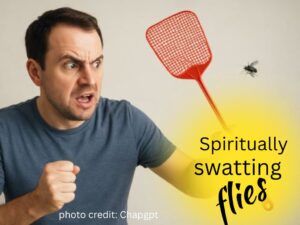 man swatting a fly